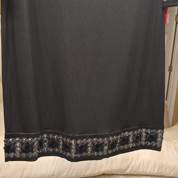 Tiana B. Elegant Black Dress with Embellished Cuffs - Picture 4 of 15